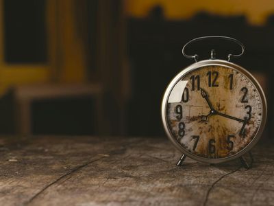 Sand clock on a wooden table